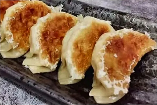 Four Japanese pork and vegetable dumplings